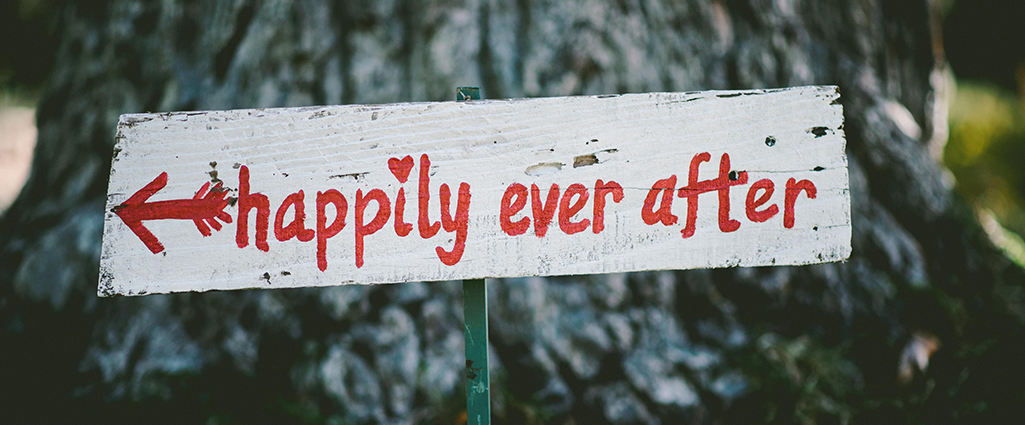 "Happily ever after" sign on a tree. Love & compassion, your way to paradise.